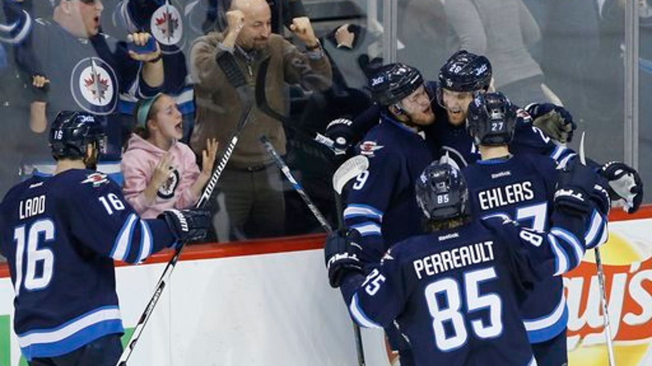 Wheeler scores early in OT and Jets beat Predators 5-4